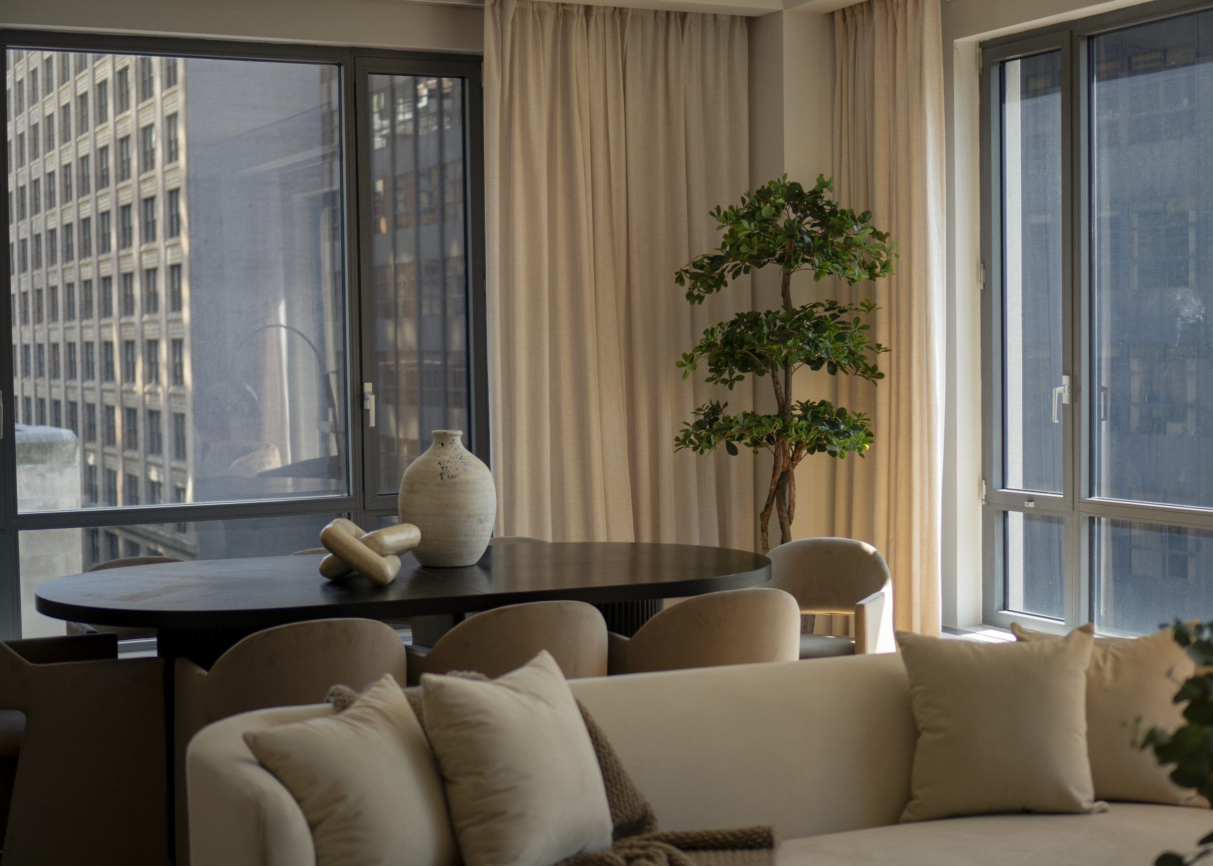 Living and dining room at 50 Madison in NoMad, Manhattan, staged by Stage One